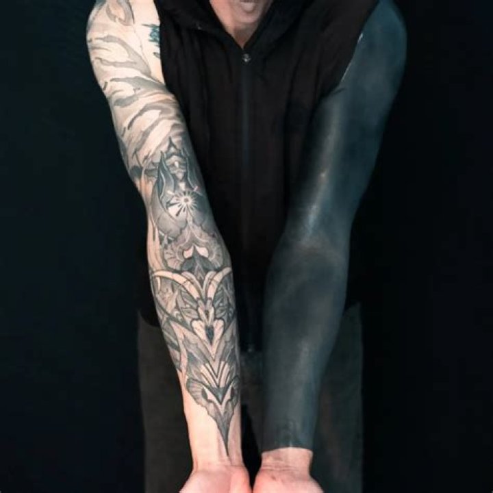 Ultimate Inspiration: Discover Mesmerizing Blackout Sleeve Tattoo Ideas