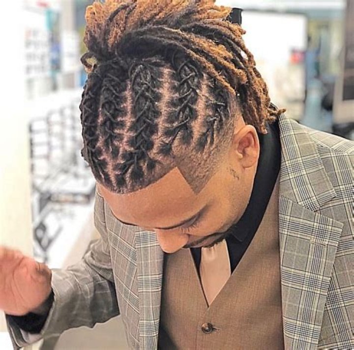 Uplevel Your Style: Dread Updo Inspiration For Men
